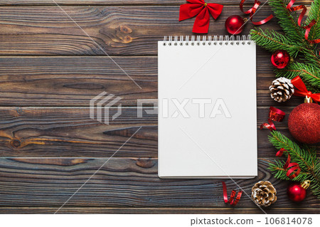 Christmas blank greeting card mock-up scene. Creative layout made of Christmas tree branches and paper card note. Flat lay. Nature New Year concept 106814078