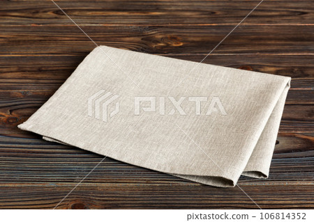 top view with gray kitchen napkin isolated on table background. Folded cloth for mockup with copy space, Flat lay. Minimal style top view with gray kitchen napkin isolated on table background. Folded cloth for mockup with copy space, Flat lay. Minimal style 106814352
