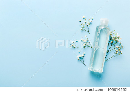Fancy healthcare bottles for serum, micellar, tonic, toner, lotion, water and cream with gypsophila branch. Natural oranic spa cosmetics concept. Mockup, template, Top view Fancy healthcare bottles for serum, micellar, tonic, toner, lotion, water and cream with gypsophila branch. Natural oranic spa cosmetics concept. Mockup, template, Top view 106814362