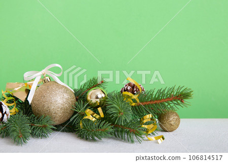 New Year Christmas tree toy, branches of a christmas tree, New Year decorations on a colored background 106814517
