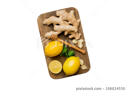 Natural cold and flu home remedies. Natural ingredients for immunity stimulation and viruses protection. top view flat lay isolated on white background Natural cold and flu home remedies. Natural ingredients for immunity stimulation and viruses protection. top view flat lay isolated on white background 106814550