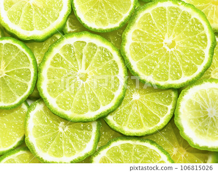 Fresh kaffir lime or bergamot herb fruit slice background. Fresh kaffir lime or bergamot herb fruit slice background. 106815026