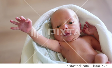 newborn. baby newborn a close-up lies looking at the camera in the hospital maternity hospital. happy family baby dream lifestyle concept. cute newborn baby wrapped in a blanket newborn. baby newborn a close-up lies looking at the camera in the hospital maternity hospital. happy family baby dream lifestyle concept. cute newborn baby wrapped in a blanket 106815250