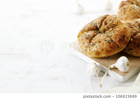 Homemade garlic bread with butter and garlic. Homemade garlic bread with butter and garlic. 106815699