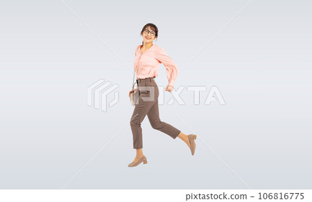 middle-aged woman jumping 106816775