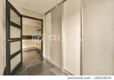an empty room with white walls and black trim on the doors, there is no one person in the room an empty room with white walls and black trim on the doors, there is no one person in the room 106816976