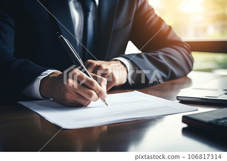 Close-up photo of a hands of an Caucasian businessman signs documents. Close-up photo of a hands of an Caucasian businessman signs documents. 106817314