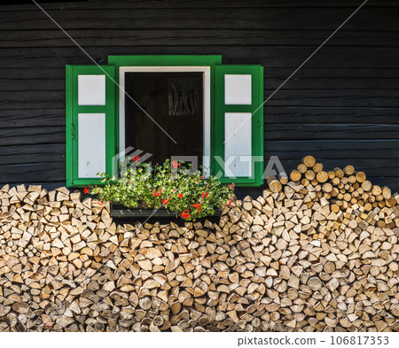 Window of a mountain hut   106817353