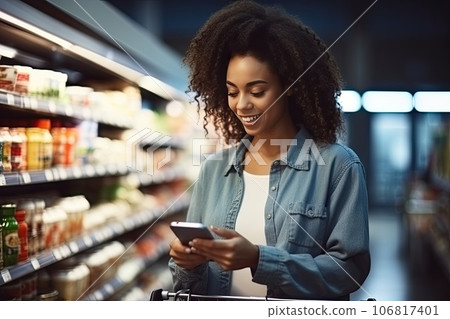 Young smiley woman is shopping at a grocery store. 106817401