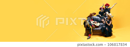 banner. Zombies family, parents and children sitting on sofa singing and dancing with guitar celebrating Halloween over bright yellow background. 106817834
