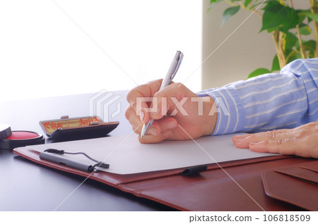 A woman filling in a document 106818509
