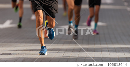 Marathon runners running on city road, large group of runners 106818644