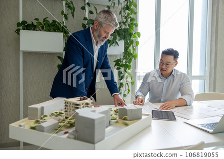 Architect men, teamwork and planning blueprint with discussion, construction goal or vision. Architect men, teamwork and planning blueprint with discussion, construction goal or vision. 106819055