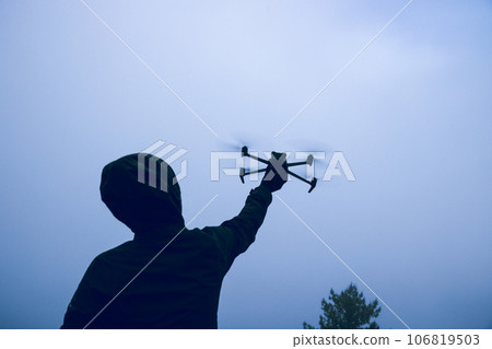 Flying drone in high altitude mountains Flying drone in high altitude mountains 106819503