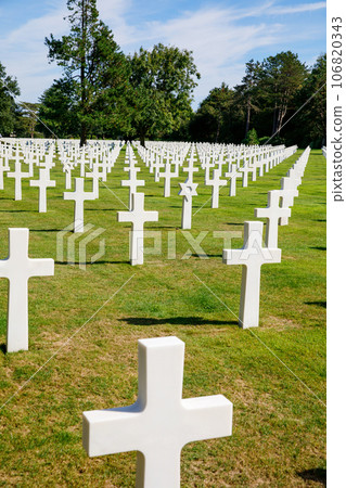 The solemn beauty of Normandy's American Cemetery, honoring brave soldiers who sacrificed during World War II, evokes reverence and gratitude 106820343