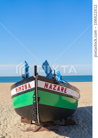 Wooden boat on the beach at Nazare, Portugal. Wooden boat on the beach at Nazare, Portugal. 106822812