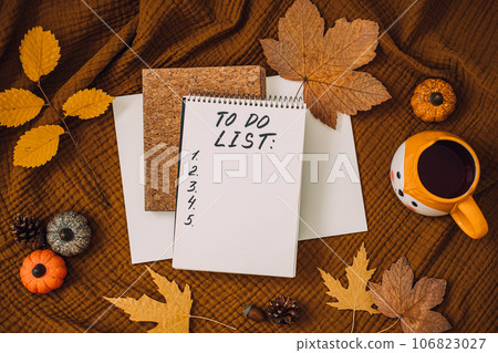 Autumn To Do List in open notepad with fall leaves at home. Fall Bucket List Autumn Activities and Fun Things to Do. Autumn To Do List in open notepad with fall leaves at home. Fall Bucket List Autumn Activities and Fun Things to Do. 106823027