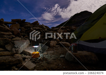 Preparing coffee at dawn at camp 106824074