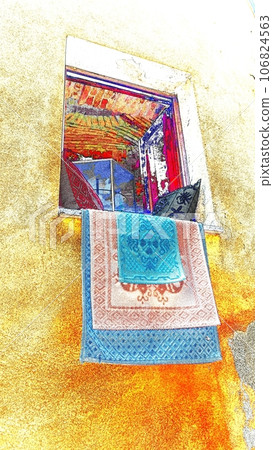 Colorful rugs and two patterned pillows on an open window of a historic downtown building. Colorful rugs and two patterned pillows on an open window of a historic downtown building. 106824563