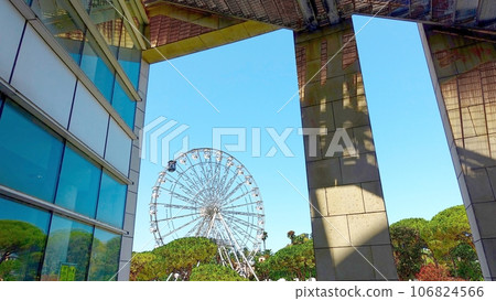 The Ferris wheel in the public gardens of Olbia in Sardinia, Italy. The Ferris wheel in the public gardens of Olbia in Sardinia, Italy. 106824566