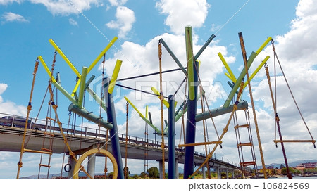 A structure for playing and a glimpse of the Olbia bridge. A structure for playing and a glimpse of the Olbia bridge. 106824569