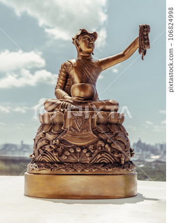 Bronze figurine of Phra upagupta or Phra bua khem statue with nature background. Bronze figurine of Phra upagupta or Phra bua khem statue with nature background. 106824998