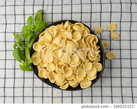 Raw Orecchiette Pasta, Homemade Dry Macaroni, Italian Recchietedde Raw Orecchiette Pasta, Homemade Dry Macaroni, Italian Recchietedde 106825323