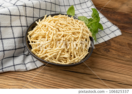 Raw Trofie Pasta, Dry Italian Macaroni, Traditional Genoa Food, Raw Noodle, Modern Ligurian Cuisine Raw Trofie Pasta, Dry Italian Macaroni, Traditional Genoa Food, Raw Noodle, Modern Ligurian Cuisine 106825337