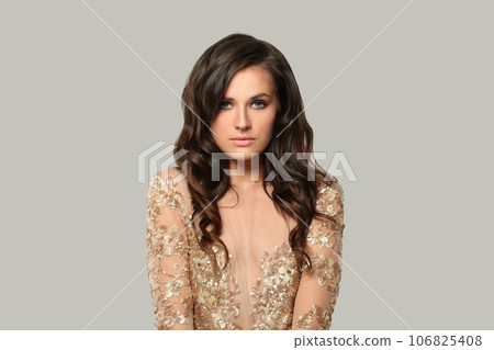 Nice good-looking brunette woman fashion model with makeup and wavy hair Nice good-looking brunette woman fashion model with makeup and wavy hair 106825408
