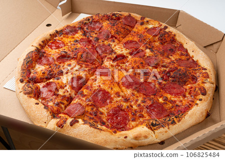Pepperoni Pizza with Pickled Hot Jalapeno Peppers in Cardboard Delivery Box, Salami Pizza Pepperoni Pizza with Pickled Hot Jalapeno Peppers in Cardboard Delivery Box, Salami Pizza 106825484