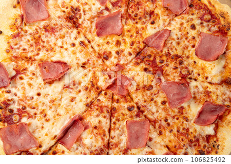 Italian Pizza in Cardboard Delivery Box, Ham Pizza with Green Hot Pepper, Chili Pepper and Mozzarella Cheese Italian Pizza in Cardboard Delivery Box, Ham Pizza with Green Hot Pepper, Chili Pepper and Mozzarella Cheese 106825492