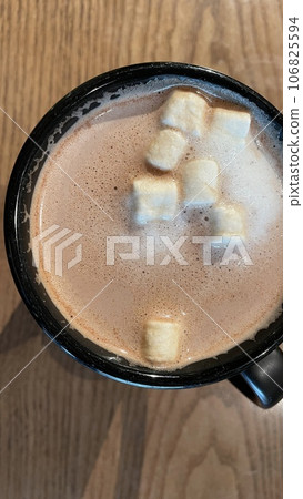 A glass of hot chocolate with marshmallows A glass of hot chocolate with marshmallows 106825594