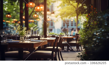 Restaurant ambient with blurred background view outside windows. Cafe with table in clam and warm surrounding. 106826205