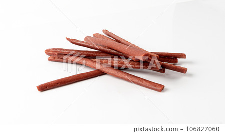 Fish Jerky Isolated, Dry Salted Seafood Snack, Hake Stockfish, Small Pieces of Dehydrated Pollock 106827060