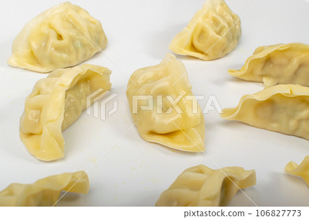 Gyoza Chinese Dumplings on WHite, Vegetable Jiaozi, Chicken Momo Pile, Asian Gyoza Group Gyoza Chinese Dumplings on WHite, Vegetable Jiaozi, Chicken Momo Pile, Asian Gyoza Group 106827773