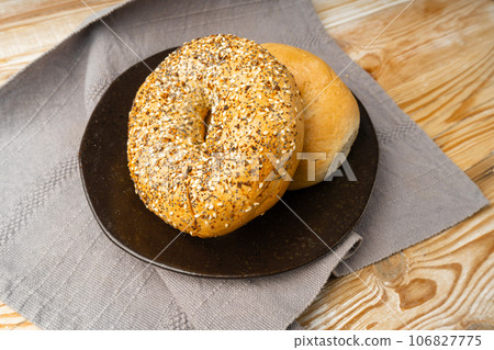 Bagel, Round Bread Bun, Wheat Bakery with Grains And Seeds for Breakfast, Plain Circle Bagel Bread 106827775