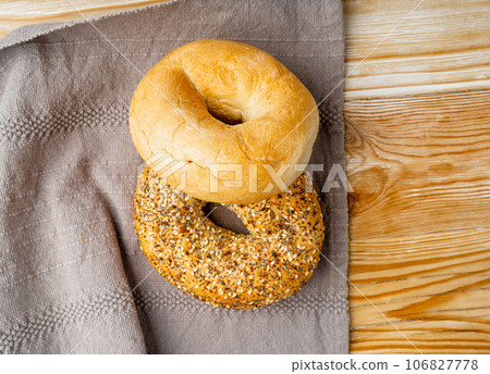 Bagel, Round Bread Bun, Wheat Bakery with Grains And Seeds for Breakfast, Plain Circle Bagel Bread 106827778