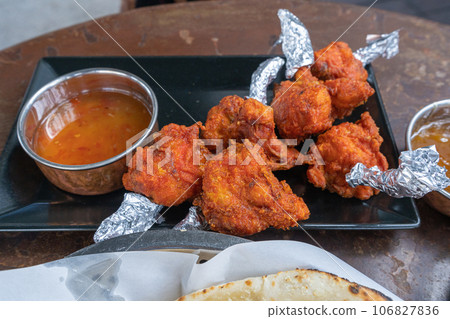 Chicken Haryali Tikka, Grilled Chicken Pieces, Tandoori Food in Hot Red Pepper Chicken Haryali Tikka, Grilled Chicken Pieces, Tandoori Food in Hot Red Pepper 106827836