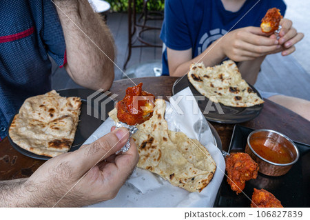 Indian Flat Bread Closeup, Traditional Flatbread also Known as Pita Bread, Roti, Chapati, Naan or Tortilla 106827839