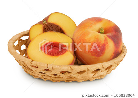 Ripe peach fruit with half in a wicker basket isolated on white background with full depth of field 106828004