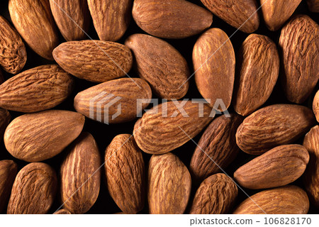 Background of large raw almonds close up. View from above. 106828170