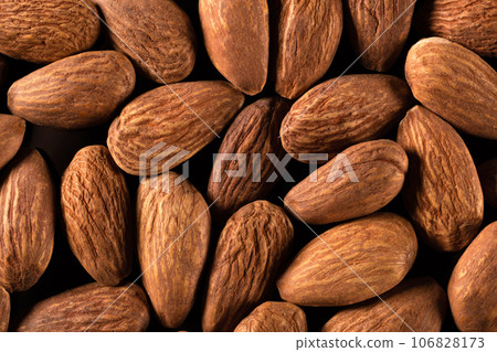 Background of large peeled almonds arranged randomly. Dried products Background of large peeled almonds arranged randomly. Dried products 106828173