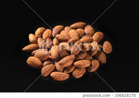 Almond isolated on black background closeup. Healthy food 106828178