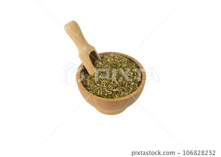 passion flower herb in latin - passiflora incarnata in wooden bowl and scoop isolated on white background. Medicinal herb. 106828232