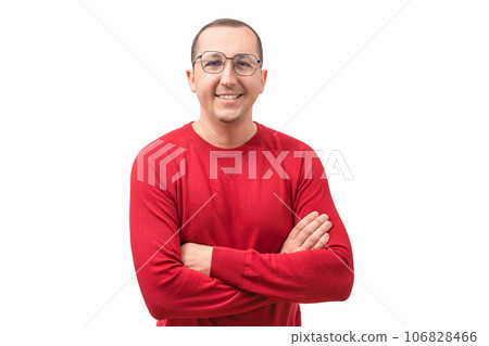 Portrait of a happy young man looking at the camera on a white background. Success concept Portrait of a happy young man looking at the camera on a white background. Success concept 106828466