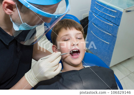 A young patient at the dentists. Medicine, dentistry and healthcare 106829146