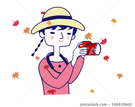 一個女孩用相機尋找秋葉和飄落的秋葉 106830668