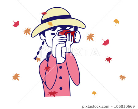 一個女孩用相機尋找秋葉和飄落的秋葉 106830669