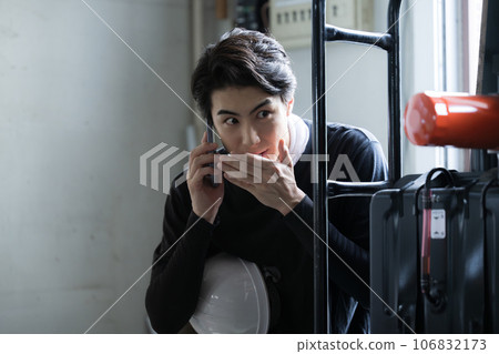 Front view of a worker reporting an accident such as a whistle-blowing incident Front view of a worker reporting an accident such as a whistle-blowing incident 106832173
