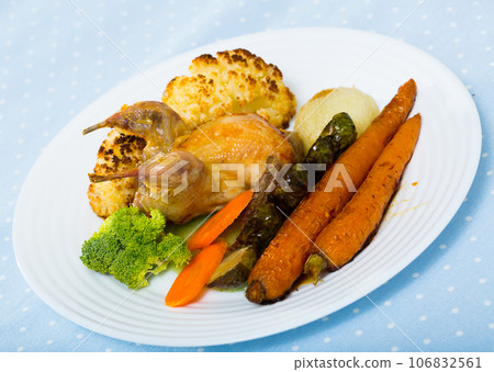 Partridge baked with vegetables Partridge baked with vegetables 106832561